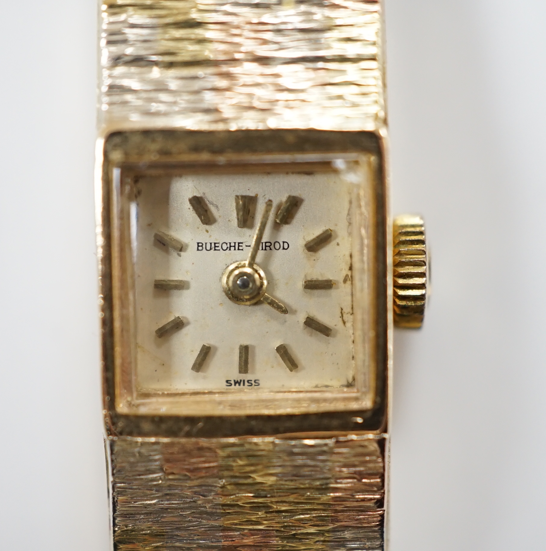 A lady's 9ct three colour gold Beuche Girod manual wind bracelet wrist watch, overall 16.7cm, gross weight 30.1 grams.